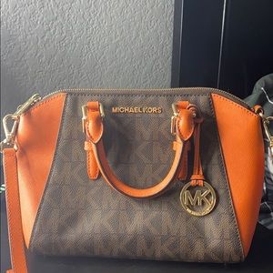 Orange and brown Michael Kors purse and wallet